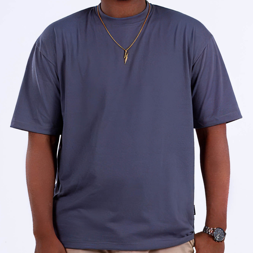 A person wearing a medium gray oversized t-shirt, front view